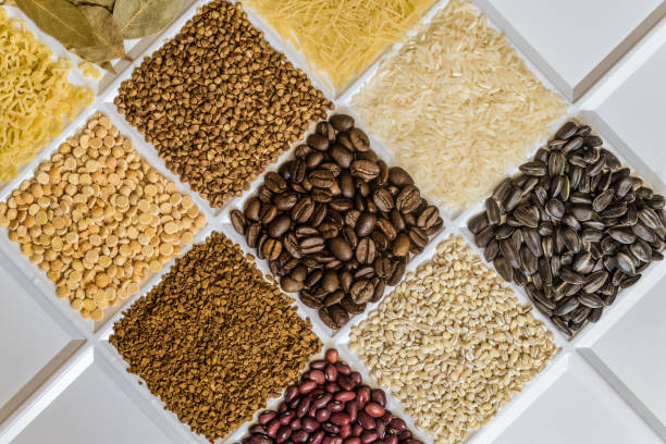 Grocery set of food products: vermicelli, rice, sunflower seeds, bay leafs, buckwheat, roasted coffee beans, pearl barley, figured macaroni, dried peas, freeze-dried instant coffee, dried seeds of beans.